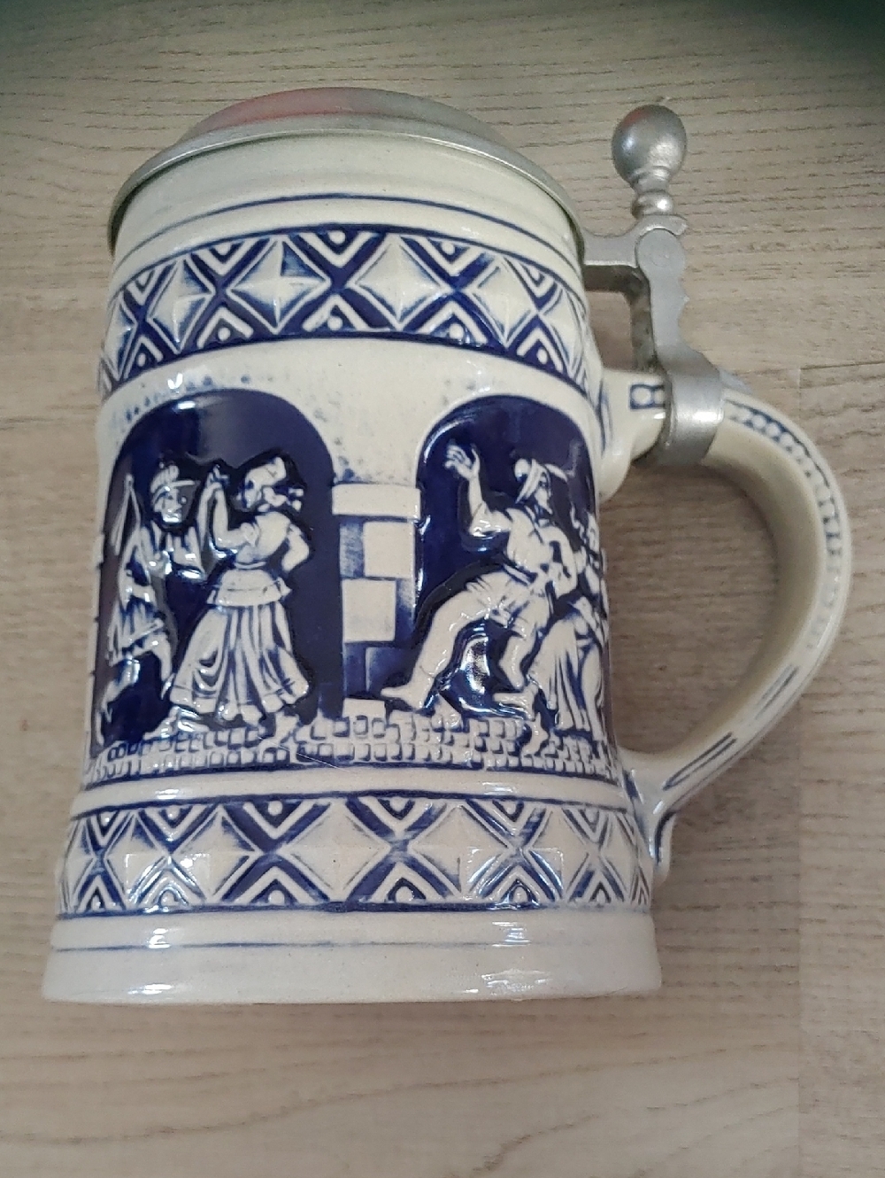 Blue and White Ceramic Relief Beer Stein with Pewter Lid